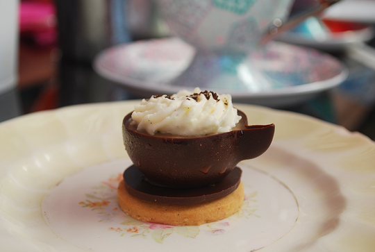 Chocolate teacup with dark chocolate mousse, coffee anglaise, whipped vanilla cream and cookie