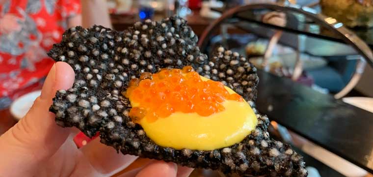 Squid ink tapioca crackers with trout roe and smoked salmon rouille