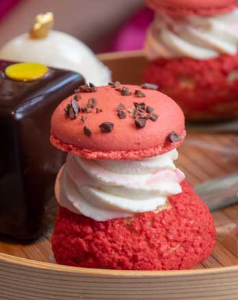 Rhubarb and strawberry profiteroles with a white chocolate and strawberry whipped ganache swirl and a rhubarb and strawberry confiture