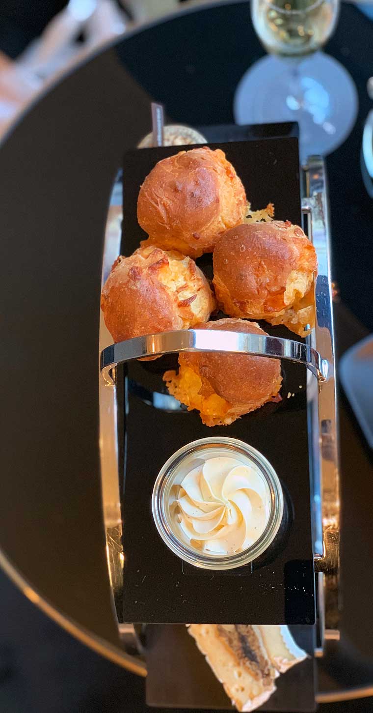 L’amuse Signature Gouda scone served with whipped spiced beurre noisette butter