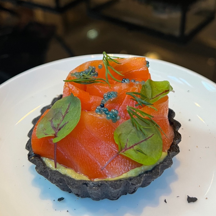Juniper cured Ōra king salmon, wild scampi caviar and handmade charcoal tart