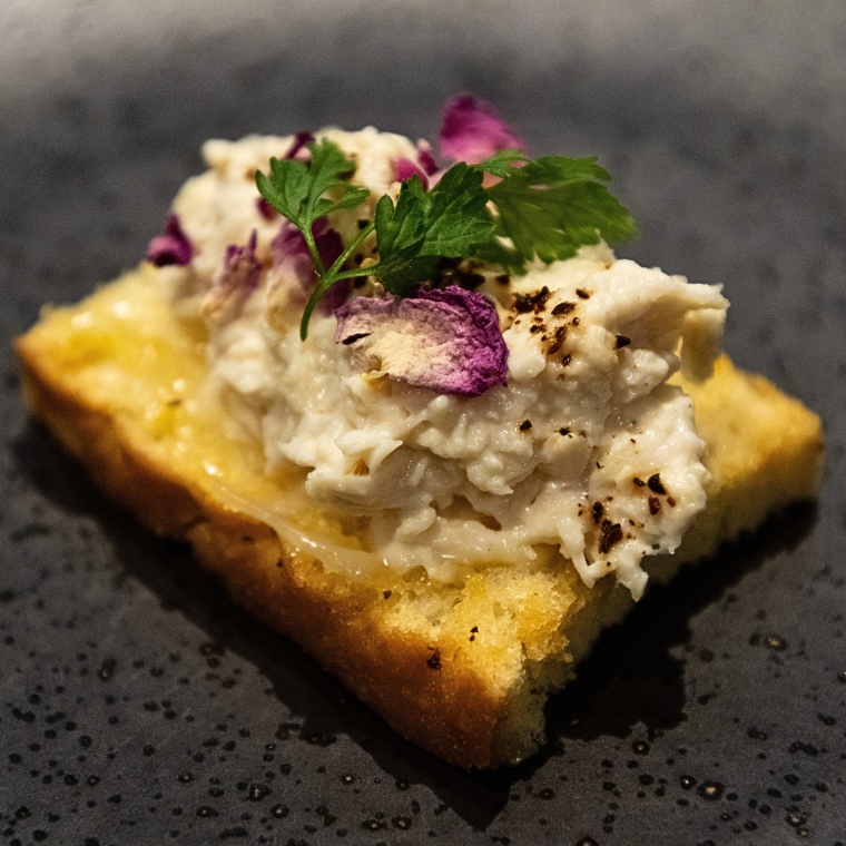 Open faced chicken and wattleseed focaccia crostini, micro amaranth