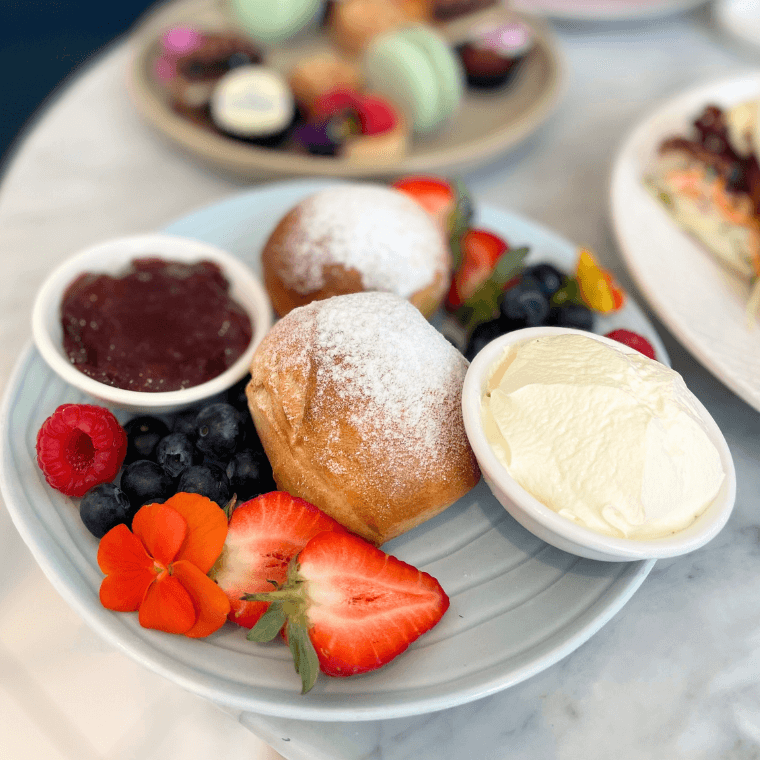 Scones with jam, cream and berries
