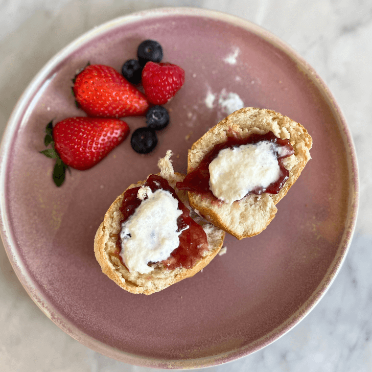 Scones with jam, cream and berries