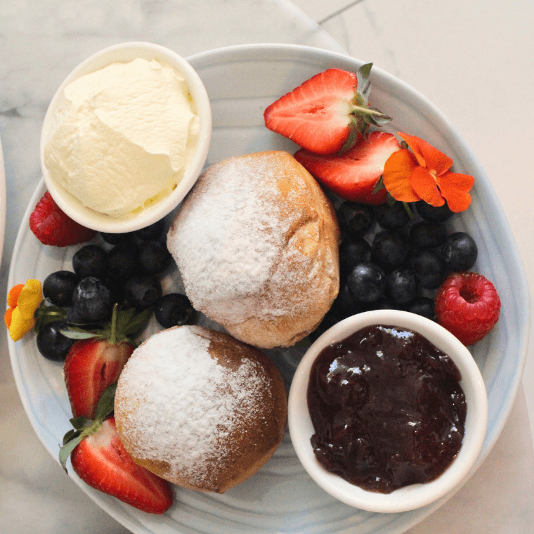 Scones with jam, cream and berries