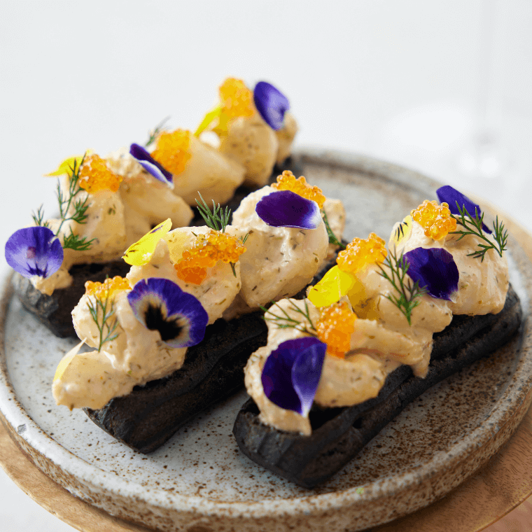 Shark Bay prawn, charcoal éclair, dill, chive, tobiko roe