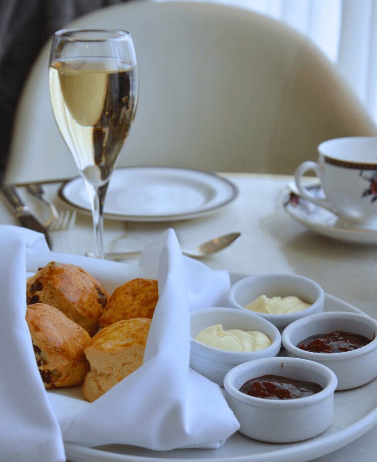 Vanilla scone and raisin scone with double cream & strawberry preserve 